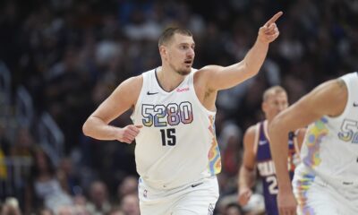 Denver Nuggets center Nikola Jokic gestures after hitting a basket in the second half of an NBA basketball game against the Phoenix Suns Monday, Dec. 23, 2024, in Denver. (AP Photo/David Zalubowski)