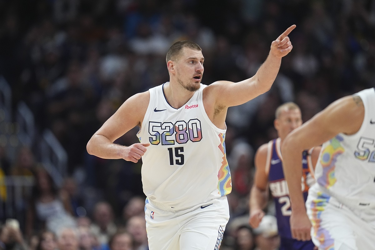 Denver Nuggets center Nikola Jokic gestures after hitting a basket in the second half of an NBA basketball game against the Phoenix Suns Monday, Dec. 23, 2024, in Denver. (AP Photo/David Zalubowski)