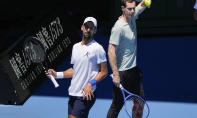 Serbia's Novak Djokovic, left, with his coach Andy Murray during a practice session ahead of the Australian Open tennis championship in Melbourne, Australia, Saturday, Jan. 11, 2025. (AP Photo/Ng Han Guan)