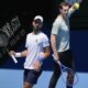 Serbia's Novak Djokovic, left, with his coach Andy Murray during a practice session ahead of the Australian Open tennis championship in Melbourne, Australia, Saturday, Jan. 11, 2025. (AP Photo/Ng Han Guan)