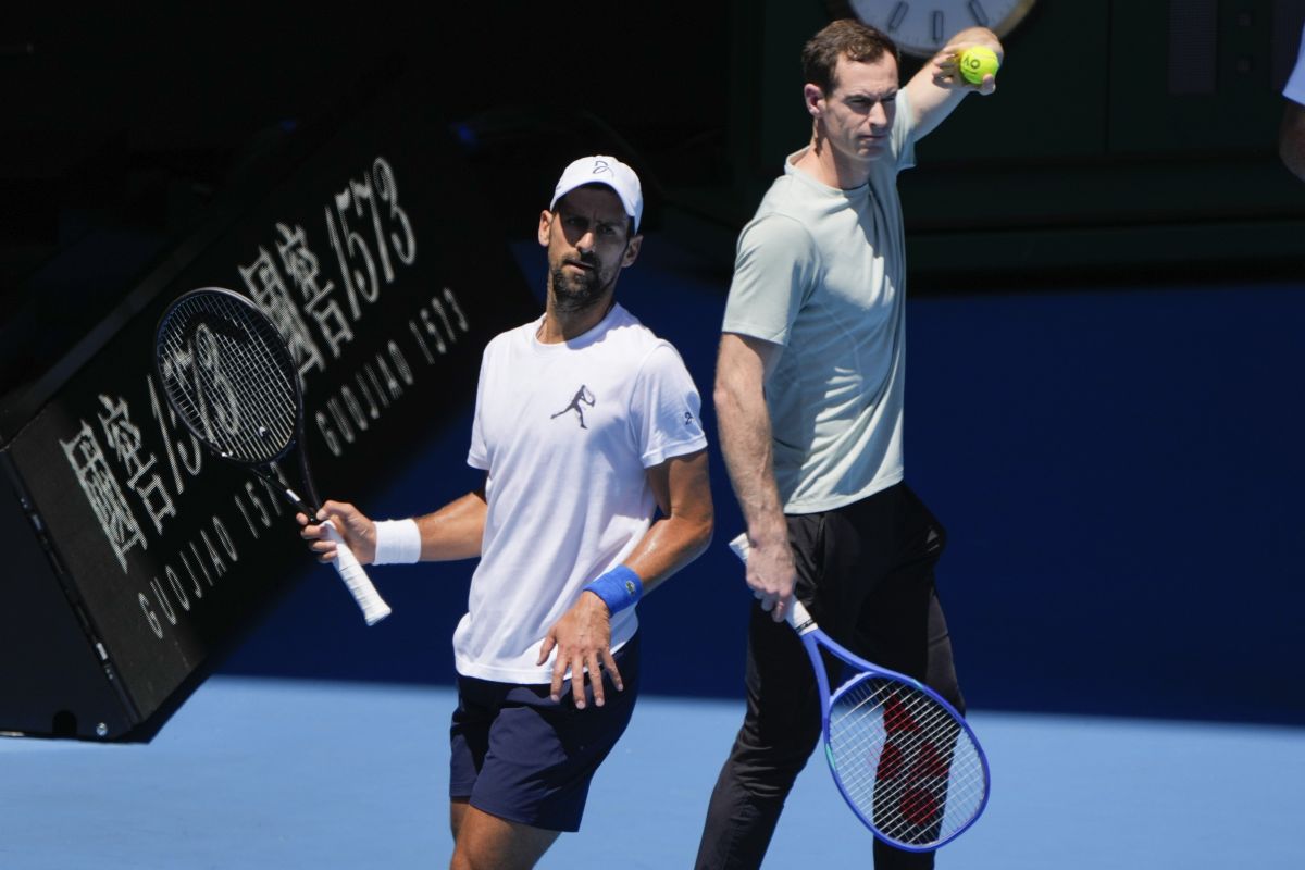 Serbia's Novak Djokovic, left, with his coach Andy Murray during a practice session ahead of the Australian Open tennis championship in Melbourne, Australia, Saturday, Jan. 11, 2025. (AP Photo/Ng Han Guan)