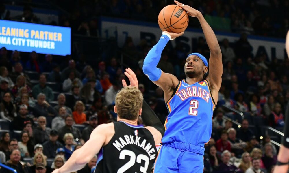 Oklahoma City Thunder guard Shai Gilgeous-Alexander (2) shoots over Utah Jazz forward Lauri Markkanen (23) during the first half of an NBA basketball game, Wednesday, Jan. 22, 2025, in Oklahoma City. (AP Photo/Kyle Phillips)