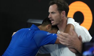 Novak Djokovic of Serbia celebrates with coach Andy Murry, right, after defeating Carlos Alcaraz of Spain in their quarterfinal match at the Australian Open tennis championship in Melbourne, Australia, early Wednesday, Jan. 22, 2025. (AP Photo/Asanka Brendon Ratnayake)