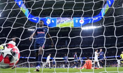 Salzburg's Samson Baidoo walks toward the ball after Real Madrid's Vinicius Junior scored his side's 5th goal during the Champions League opening phase soccer match between Real Madrid and FC Salzburg at the Santiago Bernabeu stadium in Madrid, Wednesday, Jan. 22, 2025. (AP Photo/Manu Fernandez)