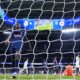 Salzburg's Samson Baidoo walks toward the ball after Real Madrid's Vinicius Junior scored his side's 5th goal during the Champions League opening phase soccer match between Real Madrid and FC Salzburg at the Santiago Bernabeu stadium in Madrid, Wednesday, Jan. 22, 2025. (AP Photo/Manu Fernandez)