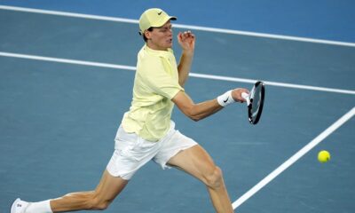 Jannik Sinner of Italy plays a forehand return to Ben Shelton of the U.S. during their semifinal match at the Australian Open tennis championship in Melbourne, Australia, Friday, Jan. 24, 2025. (AP Photo/Asanka Brendon Ratnayake)