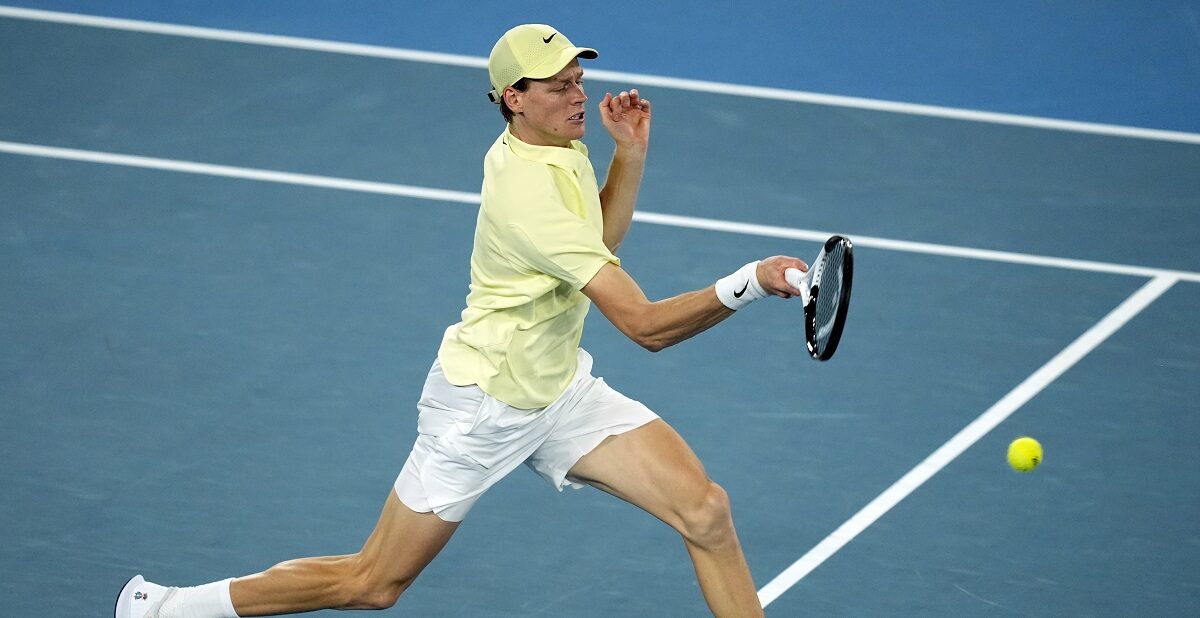 Jannik Sinner of Italy plays a forehand return to Ben Shelton of the U.S. during their semifinal match at the Australian Open tennis championship in Melbourne, Australia, Friday, Jan. 24, 2025. (AP Photo/Asanka Brendon Ratnayake)