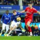 Everton's Jarrad Branthwaite, centre, and Nottingham Forest's Nikola Milenkovic battle for the ball during the English Premier League soccer match between Everton and Nottingham Forest at Goodison Park, Liverpool, England, Sunday, Dec. 29, 2024. (Peter Byrne/PA via AP)