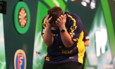 Luke Littler of England celebrates after winning the final against against Michael van Gerwen of the Netherlands at the World Darts Championship at Alexandra Palace in London, Friday, Jan. 3, 2025. (AP Photo/Kirsty Wigglesworth)