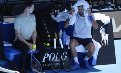 Serbia's Novak Djokovic talks with his coach Andy Murray, left, during a practice session ahead of the Australian Open tennis championship in Melbourne, Australia, Saturday, Jan. 11, 2025. (AP Photo/Ng Han Guan)