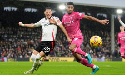 Fulham's Sasa Lukic, left, and Ipswich Town's Jens Cajuste battle for the ball during the English Premier League soccer match between Fulham and Ipswich Town at Craven Cottage stadium, London, Sunday Jan. 5, 2025. (Andrew Matthews/PA via AP)