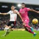 Fulham's Sasa Lukic, left, and Ipswich Town's Jens Cajuste battle for the ball during the English Premier League soccer match between Fulham and Ipswich Town at Craven Cottage stadium, London, Sunday Jan. 5, 2025. (Andrew Matthews/PA via AP)