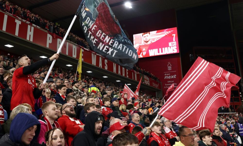 Nottingham Forest fans support their team prior the English Premier League soccer match between Nottingham Forest and Liverpool at the City Ground stadium in Nottingham, England, Tuesday, Jan. 14, 2025. (AP Photo/Darren Staples)