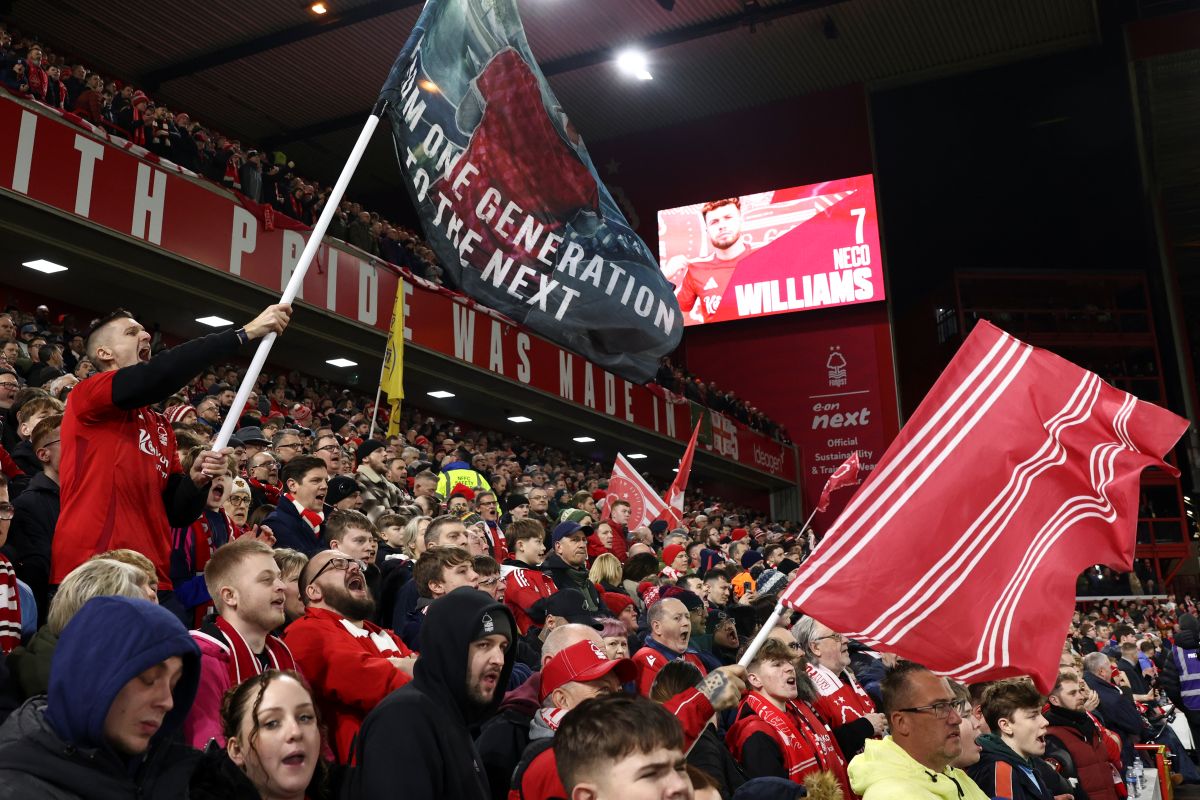 Nottingham Forest fans support their team prior the English Premier League soccer match between Nottingham Forest and Liverpool at the City Ground stadium in Nottingham, England, Tuesday, Jan. 14, 2025. (AP Photo/Darren Staples)