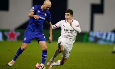 Dinamo's Josip Misic, left, and AC Milan's Christian Pulisic vie for the ball during a Champions League soccer match between Dinamo Zagreb and AC Milan at Maksimir stadium in Zagreb, Croatia, Wednesday, Jan. 29, 2025. (AP Photo/Darko Bandic)