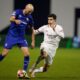 Dinamo's Josip Misic, left, and AC Milan's Christian Pulisic vie for the ball during a Champions League soccer match between Dinamo Zagreb and AC Milan at Maksimir stadium in Zagreb, Croatia, Wednesday, Jan. 29, 2025. (AP Photo/Darko Bandic)