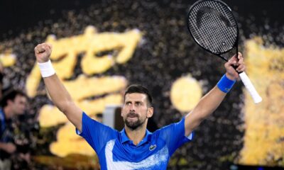 Novak Djokovic of Serbia celebrates after defeating Carlos Alcaraz of Spain in their quarterfinal match at the Australian Open tennis championship in Melbourne, Australia, Wednesday, Jan. 22, 2025. (AP Photo/Asanka Brendon Ratnayake)