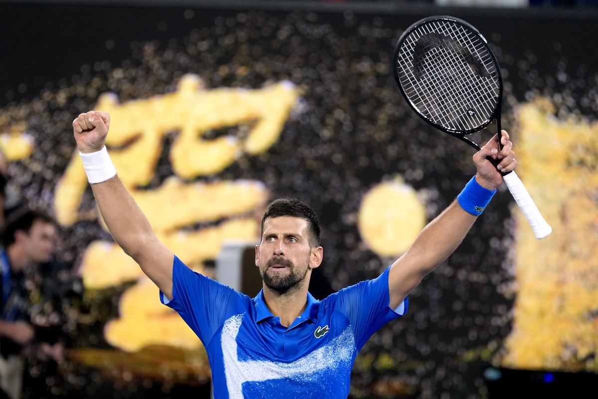 Novak Djokovic of Serbia celebrates after defeating Carlos Alcaraz of Spain in their quarterfinal match at the Australian Open tennis championship in Melbourne, Australia, Wednesday, Jan. 22, 2025. (AP Photo/Asanka Brendon Ratnayake)