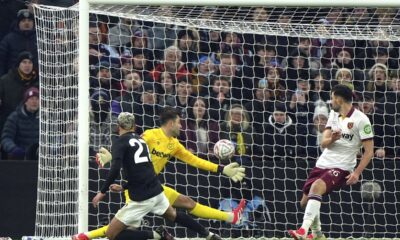 Aston Villa's Morgan Rogers, left, scores their side's second goal of the game against West Ham United during the English FA Cup third round soccer match in Birmingham, England, Friday Jan. 10, 2025. (Joe Giddens/PA via AP)