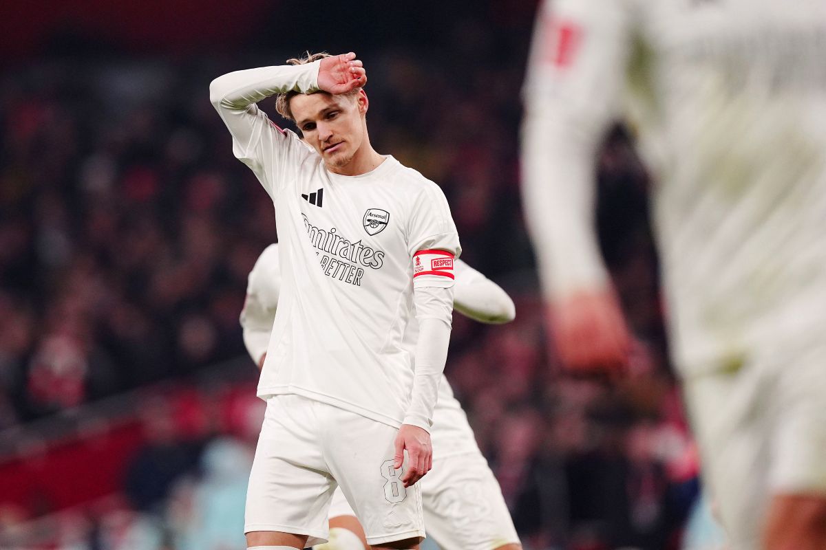 Arsenal's Martin Odegaard reacts after his penalty is saved by Manchester United goalkeeper Altay Bayindir during the English FA Cup soccer match between Arsenal and Manchester United at the Emirates stadium in London, Sunday, Jan. 12, 2025.(Mike Egerton/PA via AP)