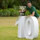 FILE - Novak Djokovic of Serbia poses with the Norman Brookes Challenge Cup in the gardens of Government House the morning after defeating Stefanos Tsitsipas of Greece in the men's singles final at the Australian Open tennis championship in Melbourne, Australia, Monday, Jan. 30, 2023. (AP Photo/Mark Baker, File)