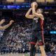 Miami Heat forward Nikola Jovic (5) attempts to shoot over Sacramento Kings forward DeMar DeRozan, left, during the first half of an NBA basketball game Monday, Jan. 6, 2025, in Sacramento, Calif. (AP Photo/Sara Nevis)