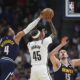 Brooklyn Nets guard Keon Johnson (45) has his shot blocked by Denver Nuggets guard Russell Westbrook (4) as center Nikola Jokic (15) covers in the second half of an NBA basketball game Friday, Jan. 10, 2025, in Denver. (AP Photo/David Zalubowski)