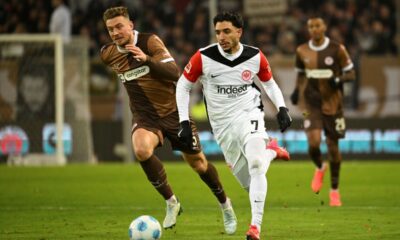 t. Pauli's Hauke Wahl, left and Frankfurt's Omar Marmoush vie for the ball, during the German Bundesliga soccer match between FC St. Pauli and Eintracht Frankfurt, in Hamburg, Germany, Saturday, Jan. 11, 2025. (Gregor Fischer/dpa via AP)