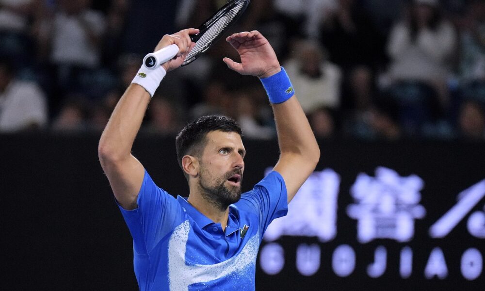 Novak Djokovic of Serbia gestures to the crowd during his quarterfinal match against Carlos Alcaraz of Spain at the Australian Open tennis championship in Melbourne, Australia, Wednesday, Jan. 22, 2025. (AP Photo/Vincent Thian)