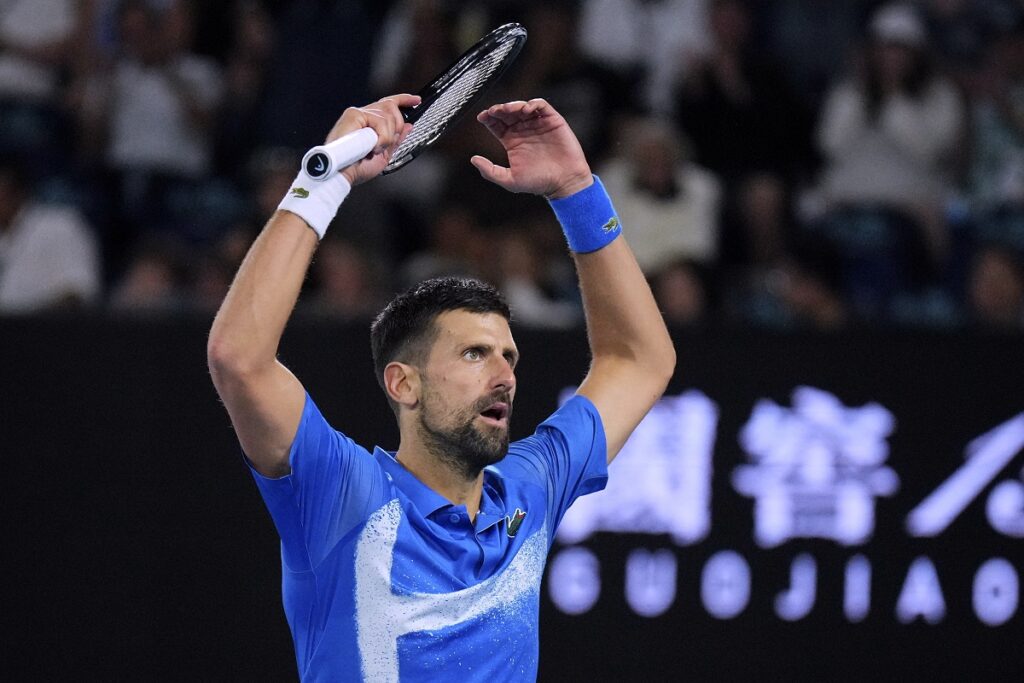 Novak Djokovic of Serbia gestures to the crowd during his quarterfinal match against Carlos Alcaraz of Spain at the Australian Open tennis championship in Melbourne, Australia, Wednesday, Jan. 22, 2025. (AP Photo/Vincent Thian)