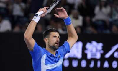Novak Djokovic of Serbia gestures to the crowd during his quarterfinal match against Carlos Alcaraz of Spain at the Australian Open tennis championship in Melbourne, Australia, Wednesday, Jan. 22, 2025. (AP Photo/Vincent Thian)