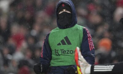 Manchester United's Alejandro Garnacho warms up prior to the English Premier League soccer match against Liverpool at the Anfield stadium in Liverpool, England, Sunday, Jan. 5, 2025. (AP Photo/Jon Super)