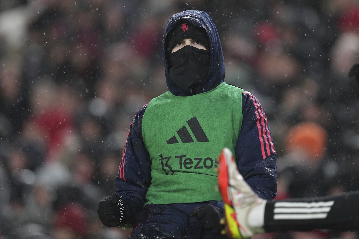 Manchester United's Alejandro Garnacho warms up prior to the English Premier League soccer match against Liverpool at the Anfield stadium in Liverpool, England, Sunday, Jan. 5, 2025. (AP Photo/Jon Super)