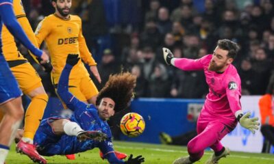 Chelsea's Marc Cucurella, left, scores his side's second goal during the English Premier League soccer match between Chelsea and Wolverhampton at Stamford Bridge stadium in London, Monday, Jan. 20, 2025. (AP Photo/Kin Cheung)