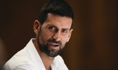 Serbia's Novak Djokovic reacts during a press conference ahead of the Australian Open tennis championship in Melbourne, Australia, Friday, Jan. 10, 2025. (AP Photo/Ng Han Guan)