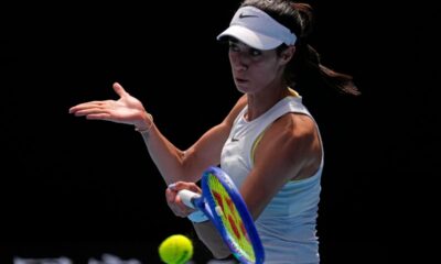 Olga Danilovic of Serbia returns a shot from Paula Badosa of Spain during their fourth round match at the Australian Open tennis championship in Melbourne, Australia, Sunday, Jan. 19, 2025. (AP Photo/Vincent Thian)