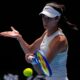 Olga Danilovic of Serbia returns a shot from Paula Badosa of Spain during their fourth round match at the Australian Open tennis championship in Melbourne, Australia, Sunday, Jan. 19, 2025. (AP Photo/Vincent Thian)