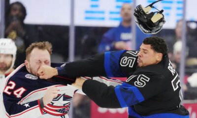 Columbus Blue Jackets' Mathieu Olivier (24) and Toronto Maple Leafs' Ryan Reaves (75) fight during the first period of an NHL hockey game in Toronto on Wednesday, January 22, 2025. (Frank Gunn/The Canadian Press via AP)