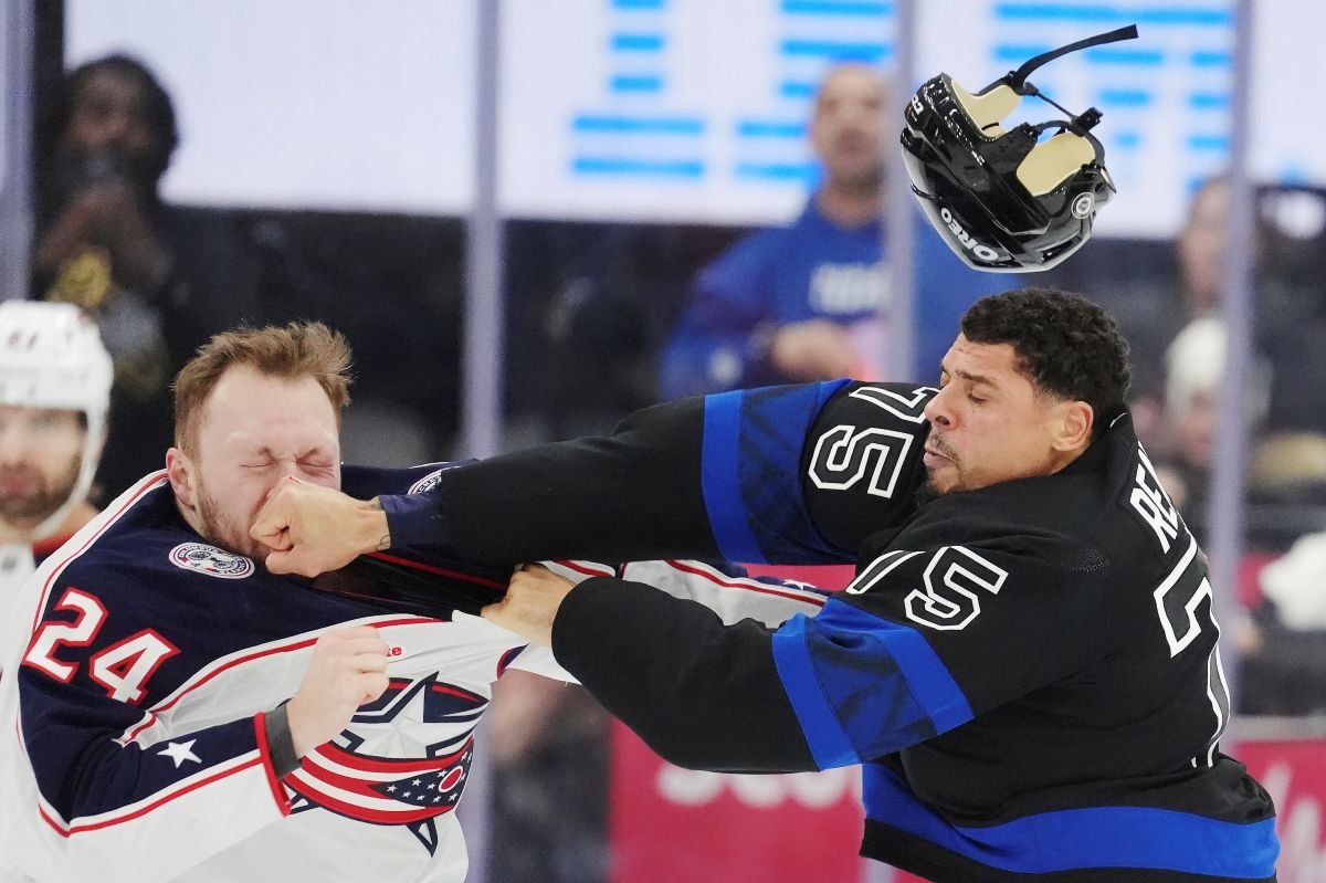 Columbus Blue Jackets' Mathieu Olivier (24) and Toronto Maple Leafs' Ryan Reaves (75) fight during the first period of an NHL hockey game in Toronto on Wednesday, January 22, 2025. (Frank Gunn/The Canadian Press via AP)