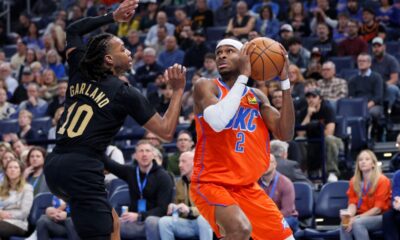 Oklahoma City Thunder guard Shai Gilgeous-Alexander (2) looks to shoot against Cleveland Cavaliers guard Darius Garland (10) during the first half of an NBA basketball game, Thursday, Jan. 16, 2025, in Oklahoma City. (AP Photo/Nate Billings)