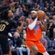 Oklahoma City Thunder guard Shai Gilgeous-Alexander (2) looks to shoot against Cleveland Cavaliers guard Darius Garland (10) during the first half of an NBA basketball game, Thursday, Jan. 16, 2025, in Oklahoma City. (AP Photo/Nate Billings)