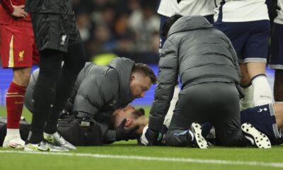 Tottenham's Rodrigo Bentancur receives medical treatment during the English League Cup semi final first leg soccer match between Tottenham and Liverpool, at the Tottenham Hotspur Stadium in London, Wednesday, Jan. 8, 2025. (AP Photo/Ian Walton)