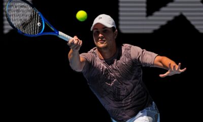 Miomir Kecmanovic of Serbia plays a forehand return to Hubert Hurkacz of Poland during their second round match at the Australian Open tennis championship in Melbourne, Australia, Thursday, Jan. 16, 2025. (AP Photo/Vincent Thian)