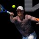 Miomir Kecmanovic of Serbia plays a forehand return to Hubert Hurkacz of Poland during their second round match at the Australian Open tennis championship in Melbourne, Australia, Thursday, Jan. 16, 2025. (AP Photo/Vincent Thian)