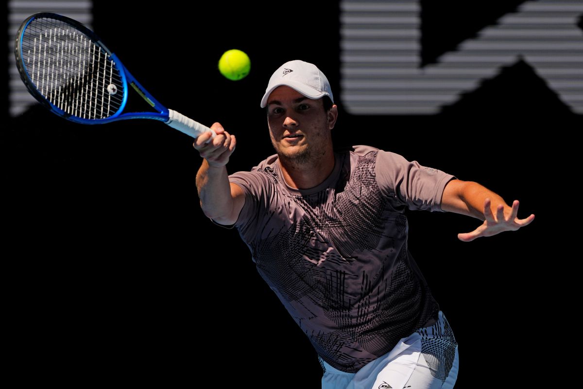 Miomir Kecmanovic of Serbia plays a forehand return to Hubert Hurkacz of Poland during their second round match at the Australian Open tennis championship in Melbourne, Australia, Thursday, Jan. 16, 2025. (AP Photo/Vincent Thian)