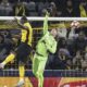 Red Star goalkeeper Ivan Gutesa, right, saves in front of Young Boys' Silvere Ganvoula during the Champions League opening phase soccer match between BSC Young Boys and (Red Star Belgrade at the Wankdorf Stadium in Bern, Switzerland, Wednesday, Jan. 29, 2025. (Alessandro della Valle/Keystone via AP)