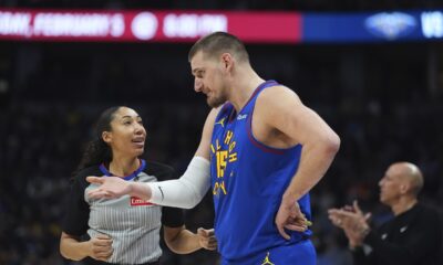 Denver Nuggets center Nikola Jokic, front right, argues with referee Simone Jelks, left, in the first half of an NBA basketball game against the Sacramento Kings, Thursday, Jan. 23, 2025, in Denver. (AP Photo/David Zalubowski)