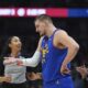 Denver Nuggets center Nikola Jokic, front right, argues with referee Simone Jelks, left, in the first half of an NBA basketball game against the Sacramento Kings, Thursday, Jan. 23, 2025, in Denver. (AP Photo/David Zalubowski)