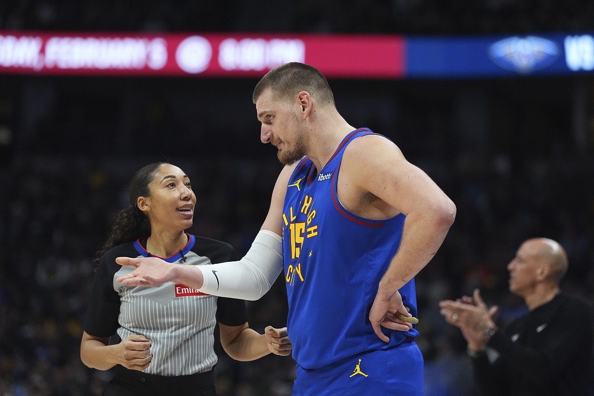 Denver Nuggets center Nikola Jokic, front right, argues with referee Simone Jelks, left, in the first half of an NBA basketball game against the Sacramento Kings, Thursday, Jan. 23, 2025, in Denver. (AP Photo/David Zalubowski)