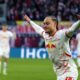 Leipzig's Xavi Simons celebrates after scoring a goal, during the German Bundesliga soccer match between RB Leipzig and SV Werder Bremen, in Leipzig, Germany, Sunday, Jan. 12, 2025. (Jan Woitas/dpa via AP)